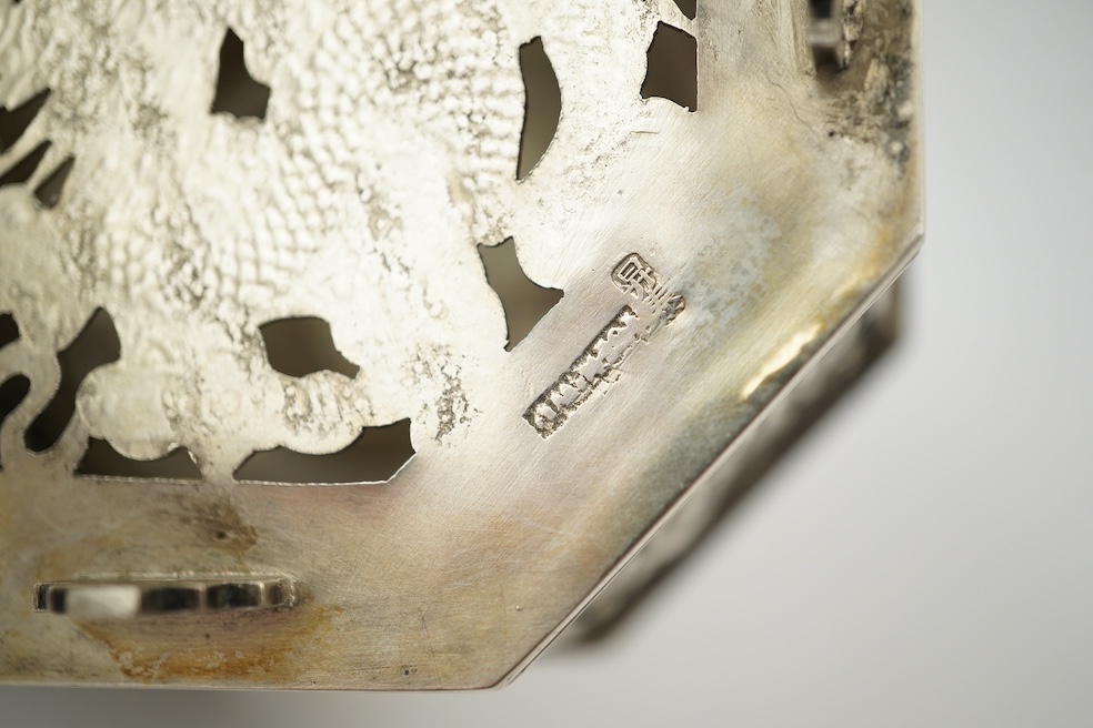 A late 19th century Chinese Export pierced silver card case, maker KMS(Kwong Man Shing), decorated with dragons amid clouds, 10.4cm, together with a Chinese Export pierced silver octagonal box and cover, by Luen Wo?, cir
